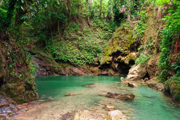Fototapeta premium Lake in a mountain gorge in the tropical jungle of the Philippines.