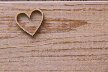 Wooden heart on wooden background