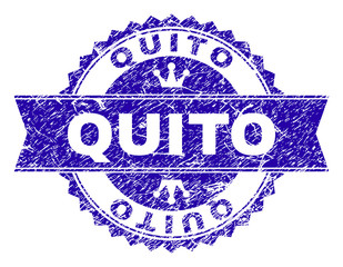 QUITO rosette stamp seal overlay with grunge style. Designed with round rosette, ribbon and small crowns. Blue vector rubber watermark of QUITO caption with grunge texture.