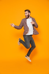 Full length portrait of a cheerful young man