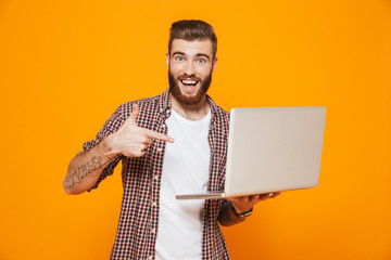 Portrait of a cheerful young man wearing casual clothes