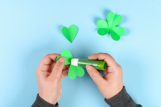 DIY green clover St. Patricks Day on blue background.