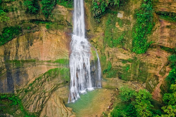 Waterfalls in a mountain gorge in the tropical jungles of the Philippines, Cebu. Aerial view from the drone.