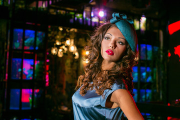 Fototapeta premium Closeup portrait of young beautiful woman in a designer ehat