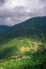 Fototapeta na wymiar mountain range view. Timelapse Of Moving Sunlight And Fog over Himalayan mountain range in Sainj
