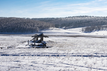 Winter view of an abandoned pig farm in the village