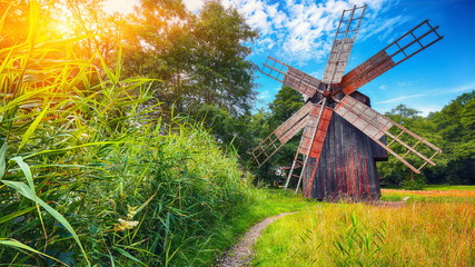 Amazing summer view of traditional romanian windmill