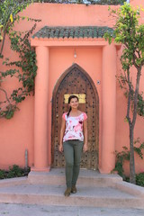 Fototapeta na wymiar woman in front of door in marrakesh