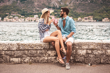 Couple in love, enjoying the summer time by the sea.