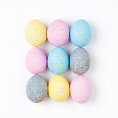 Stylish Set of 9 pale pink, blue, yellow and gray Easter eggs. Compositions in pastel colors.  Easter concept