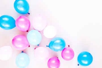 Colorful balloons on pastel color background. Festive or birthday party concept. Flat lay, top view.