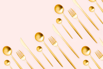 Pattern made of cutlery on pastel background, flat lay, top view. Minimalist concept.
