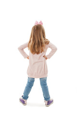 Back view of little girl looking at wall. Rear view. Isolated on white background 