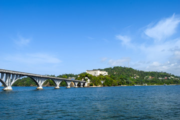 Bridge of Samana leading to little island through atlantic ocean in dominican republic