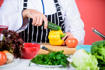 Vegetarian recipe concept. Vegetarian restaurant. Buy fresh vegetables grocery store. Hipster chief chef vegetarian cafe. Choose vegetarian lifestyle. Man cook hat apron hold fresh vegetables