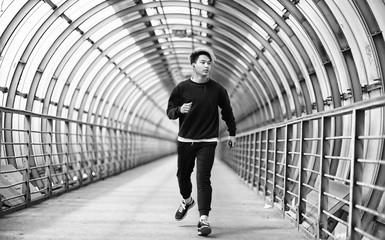 A man in sportswear run outdoors monochrome photo