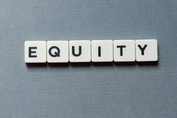 Business and finance concept.Equity letter on grey background.