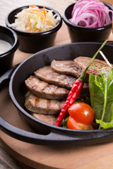 Fired beef tongue served with chili pepper