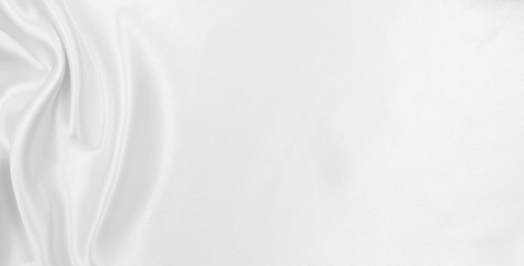 Obraz premium Smooth elegant white silk or satin luxury cloth texture as wedding background. Luxurious background design