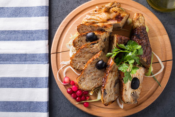 Stuffed chicken on wooden board. Top view. Copy space