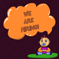 Fototapeta premium Text sign showing We Are Hiring. Conceptual photo pay someone to do a particular job for company in future Baby Sitting on Rug with Pacifier Book and Blank Color Cloud Speech Bubble