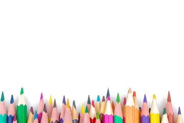 Many color pencils on white isolated background. close-up. view from above. stationery. space for text