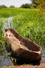 Obraz premium Mokoro on river shore