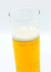 Glass of beer on a light background