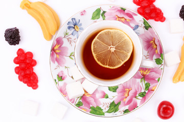 a cup of tea with marmalade and sugar