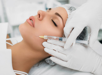 botulinum toxin injection into face, for lifting skin . Face injection for skin rejuvenation