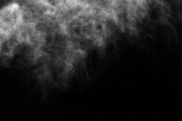 A stream of water and a cloud of drops