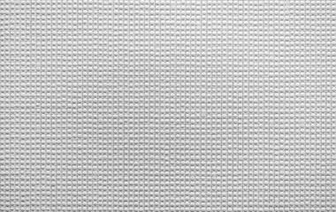 White dotted wall background: relief texture.