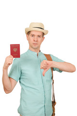 The man with the international passport in a hat and a traveling bag