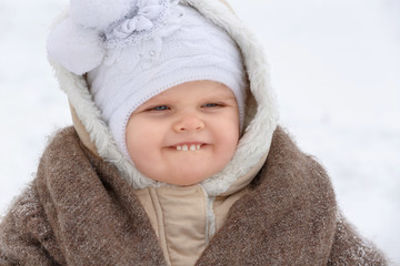 Portrait of a little girl of nursery age in winter