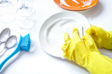 concept of woman washing dishes on white background