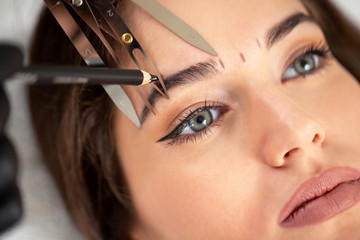Cosmetician preparing to make a legit appearance of naturally full brows - obrazy, fototapety, plakaty