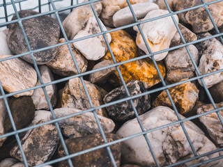 decorative stones in a cage
