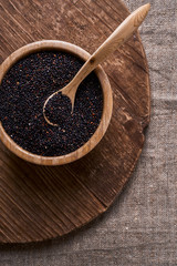 bowl with raw black quinoa 