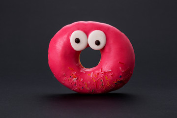 red glazed donuts with funny eyes