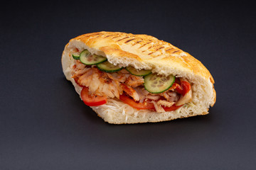 Close up of doner kebab on black background