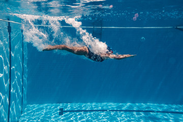 Woman diving in swimming pool