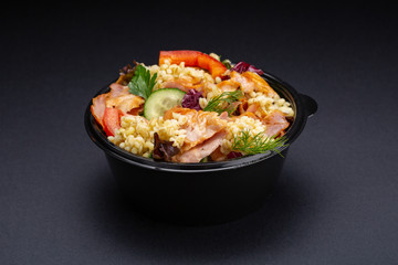 Fresh vegetable salad with grilled chicken breast - tomatoes, cucumbers, radish and mix lettuce...