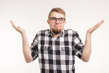Fototapeta premium Puzzled student man in plaid shirt over white backgroung