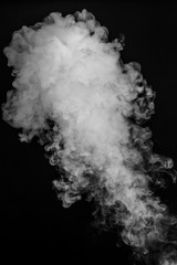 Cloud of vapor. dark black background