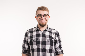 People, portrait and education concept - Smiling student man in plaid shirt over white background