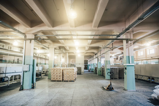 Warehouse in factory interior inside with boxes and other equipment