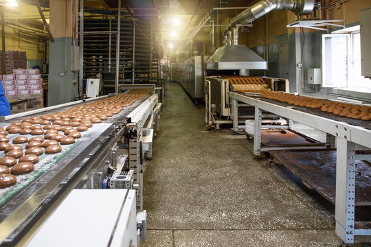 Industrial Baking Food Factory Interior With Conveyor Line Or Belt. Bakery Workshop, Cake And Cookie Production Process