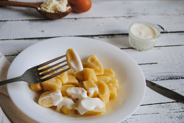 Dumplings in a white plate on a white background