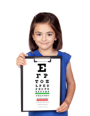 Beautiful child holding a vision exam chart