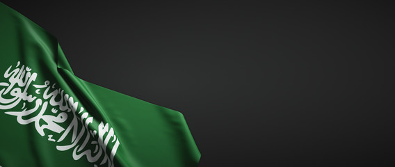 Saudi Arabia flag fabric on plain dark background